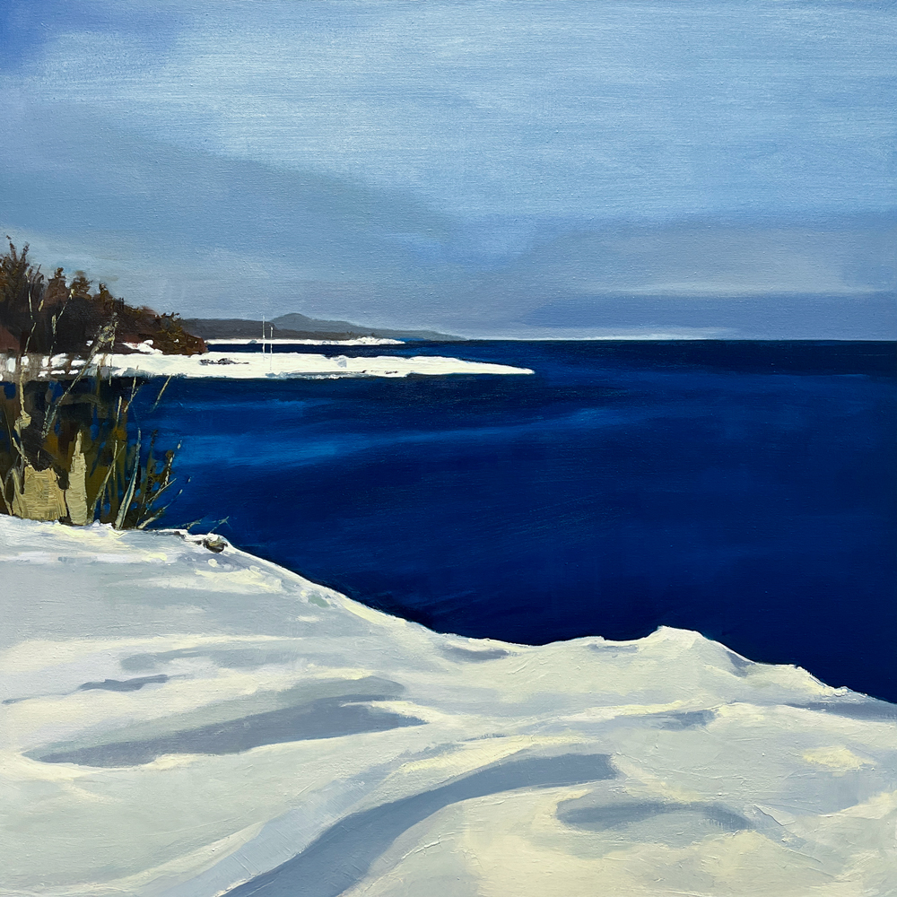 Landscape painting of a snow-covered shore meeting deep blue water under a cool winter sky, with distant headlands and dried grasses at the edge of the snowbank, by Joanna Aplin, Canadian fine artist based in Owen Sound Ontario.