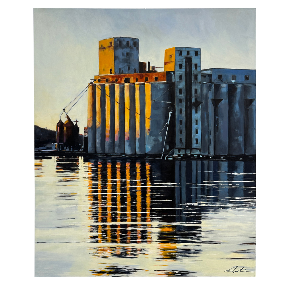 Painting of industrial grain elevators bathed in warm golden light and reflected in dark harbour water, with strong vertical lines and dramatic contrast, by Joanna Aplin, Owen Sound Ontario artist