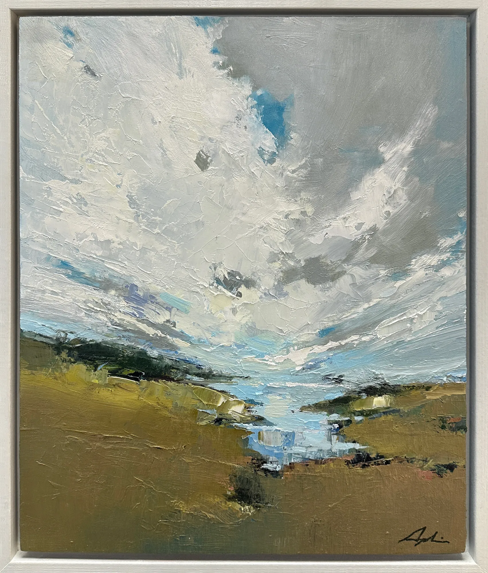 Oil on panel — a landscape of towering white and grey clouds billowing above green-gold fields with a stream winding toward the horizon, shown in a white float frame, by Joanna Aplin, Georgian Bay artist