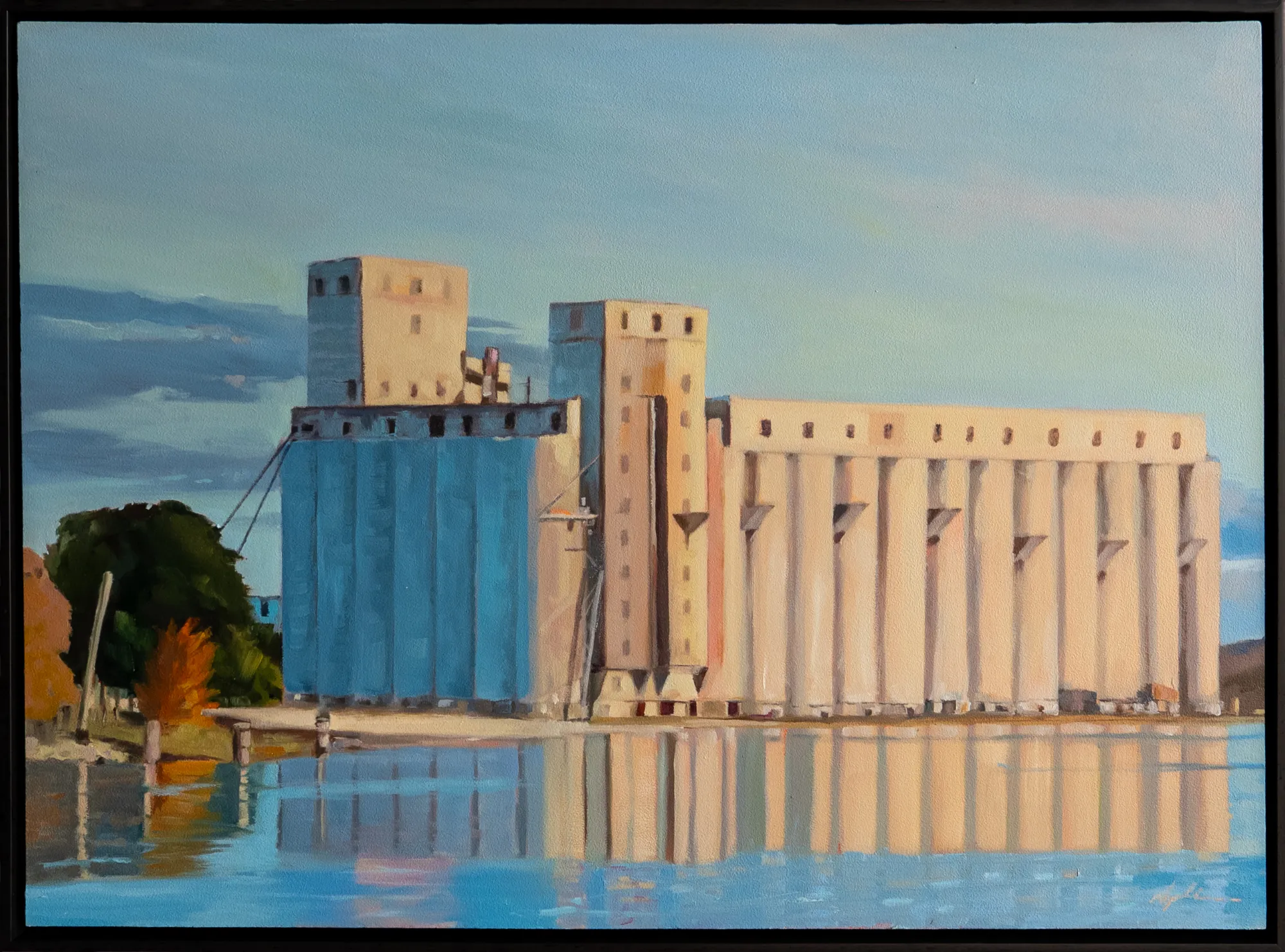 Oil on panel landscape painting of grain elevators reflected in calm harbour water, bathed in warm afternoon light with touches of autumn foliage, by Georgian Bay artist Joanna Aplin, Owen Sound Ontario.