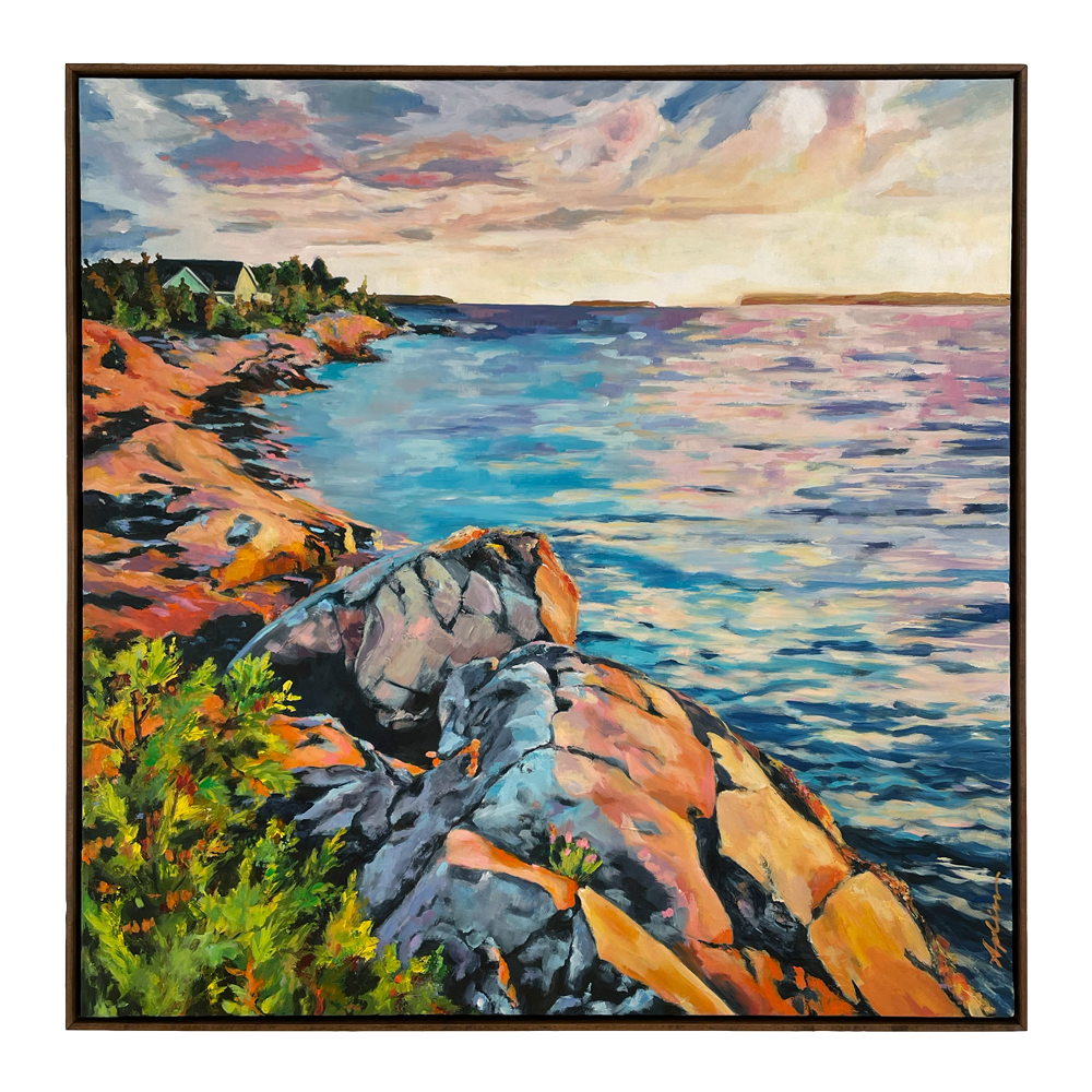 Landscape painting of colourful Georgian Bay rocks and green shrubs descending to shimmering turquoise water under a pink and lavender sunset sky with cottages in the distance, shown in a float frame, by fine artist Joanna Aplin