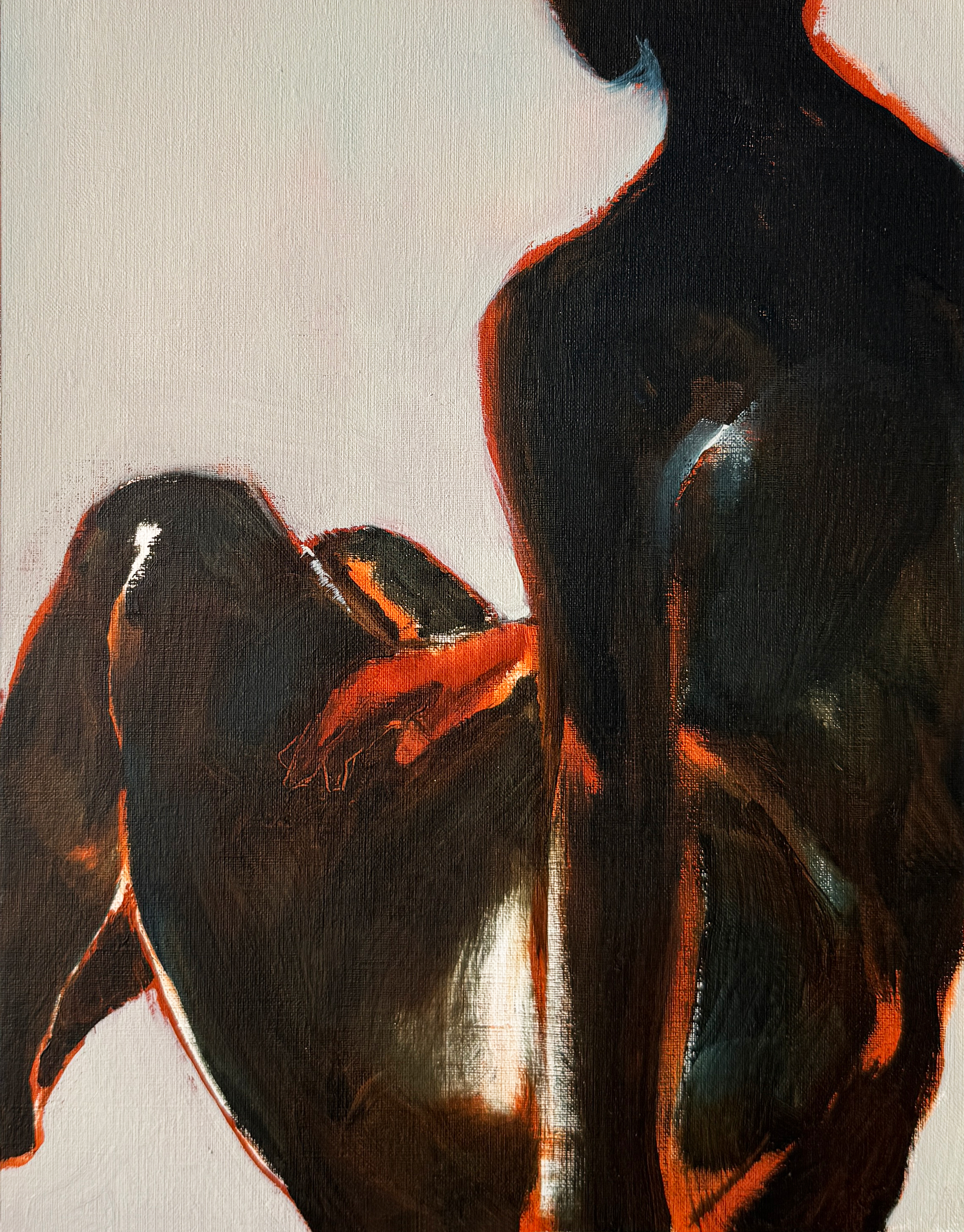 Two dark, cropped figure forms overlap against a white ground, defined by deep brown-black masses and sharp orange-red highlights.
